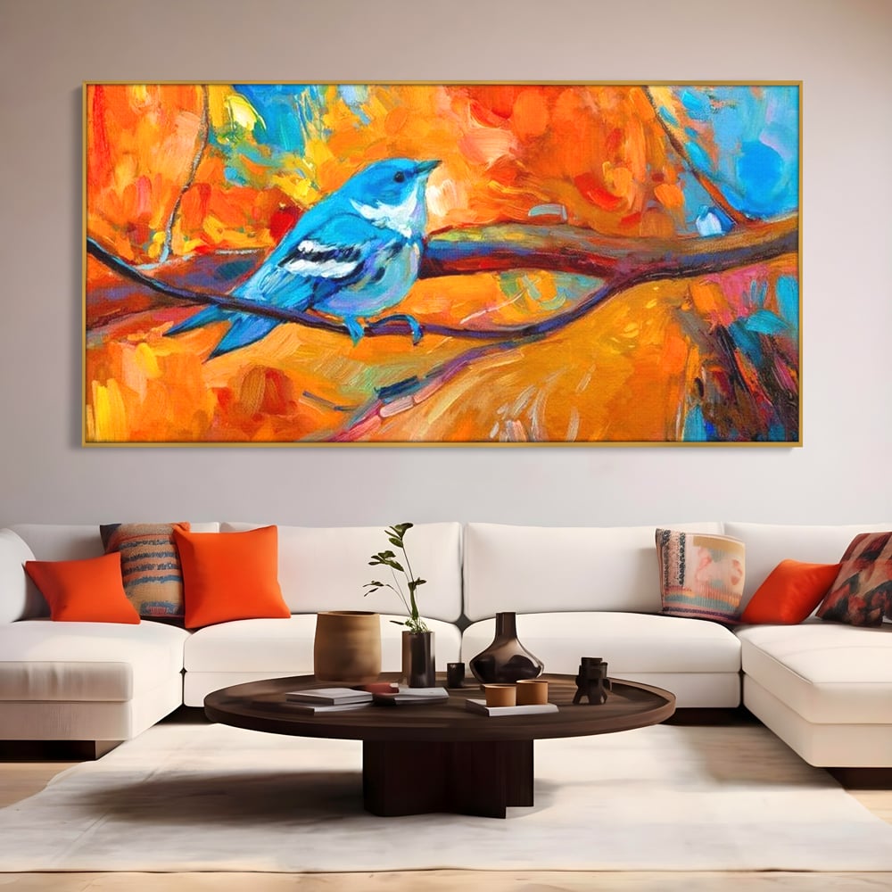 Tablou canvas cu tablou canvas cu pasare albastra pe ramura, in rama de aluminiu auriu, pe perete intr-un living